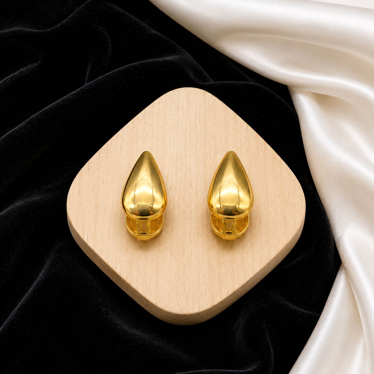 Raannii Gold Teardrop Statement Stud Earrings