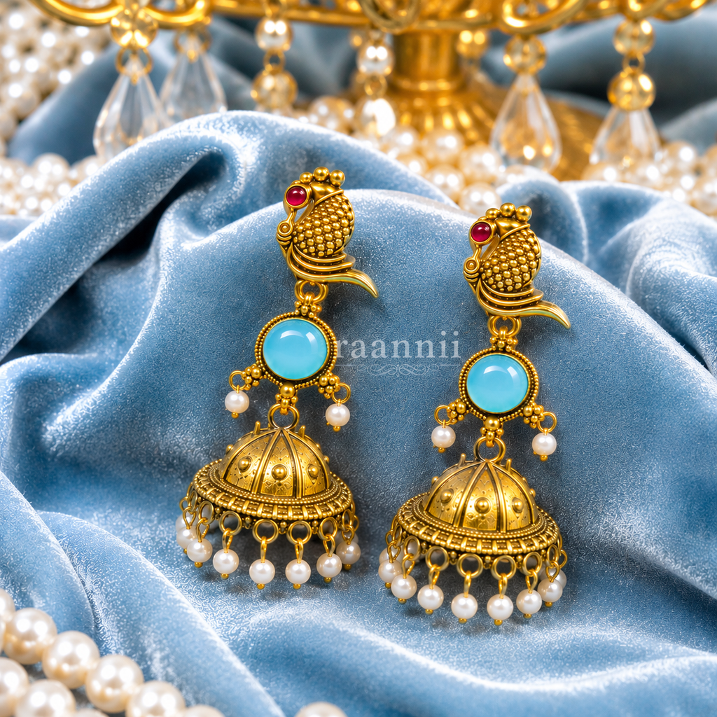 Raannii Earrings Gold Tone Peacock Jhumka with Blue Stone & Pearl Drops